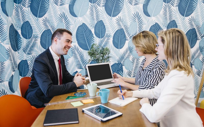 smiling-man-women-working-laptop